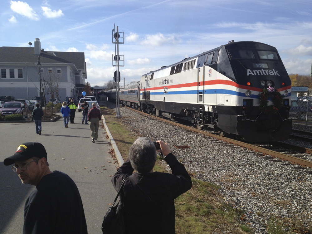 The Downeaster pulls into Brunswick Station while on its inaugural run north of Portland to Freeport and Brunswick in this 2012 file photo. Rail advocates say they would like to extend the line from Brunswick to Augusta.
