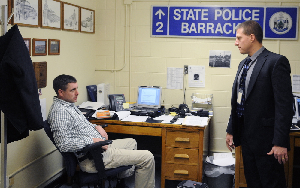 Maine State Police Sgt. Jeff Love, right, the lead detective in the Ayla Reynolds case, confers with Troop D Detective Adam McNaughton at the state police barracks in Augusta last week.