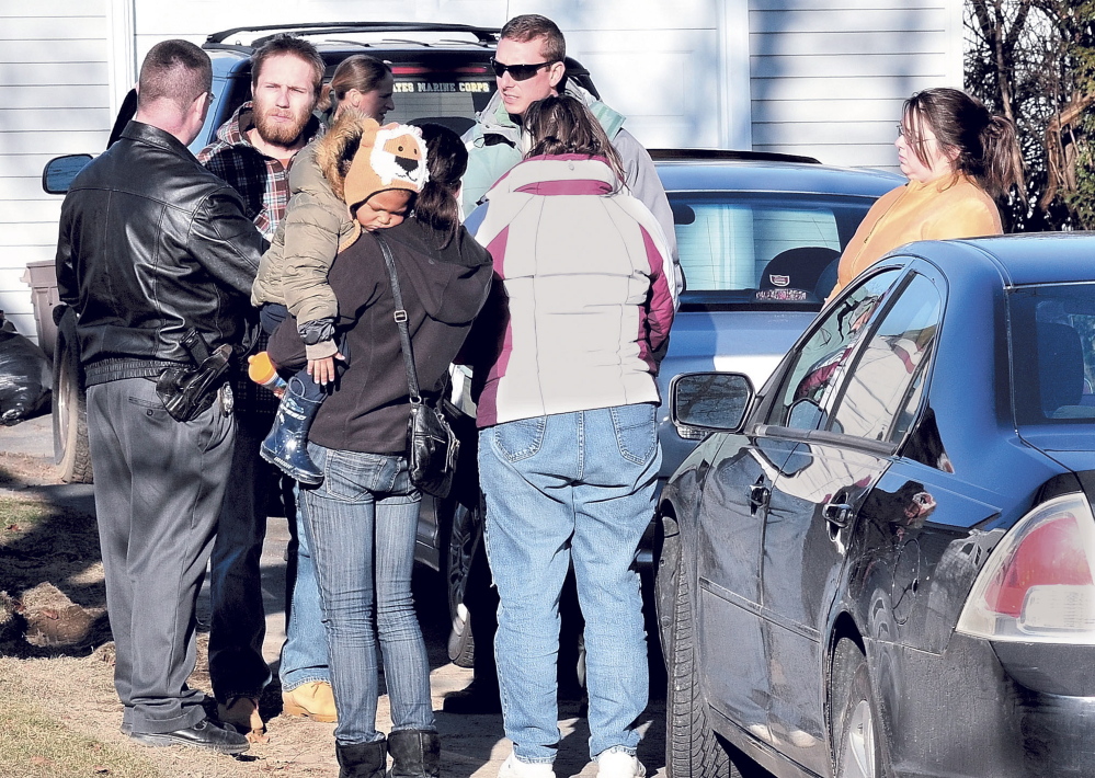 Maine State Police Detective Christopher Tupper, left, and Waterville Detective Lincoln Ryder, at right, question Justin DiPietro after he arrived at his home on Violette Ave. in Waterville on Dec. 18, 2011, during the beginnings of the search for his 20-month-old daughter, Ayla Reynolds, whom he reported missing the morning before.