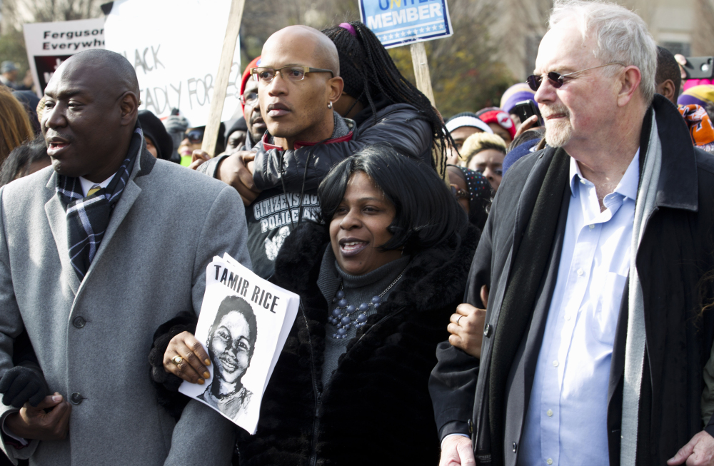 Samaria Rice center, the mother of Tamir Rice, the 12-year old boy who was fatally shot by police officer in Cleveland, and others, march in Pennsylvania Avenue toward Capitol Hill in Washington, Saturday, during the Justice for All rally.