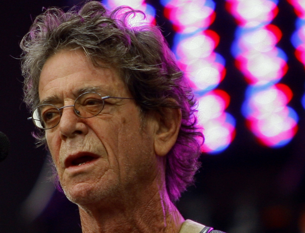 In this Sunday, Aug. 9, 2009, file photo, Lou Reed performs at the Lollapalooza music festival, in Chicago.