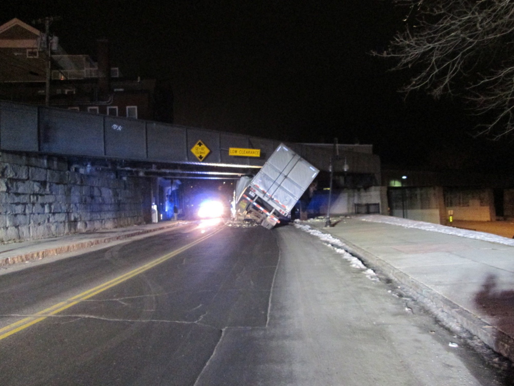 A tractor-trailer got stuck under the railroad bridge on Water Street in Augusta around 11:30 p.m. Monday. The driver wasn’t injured, but the trailer was damaged extensively, police said.