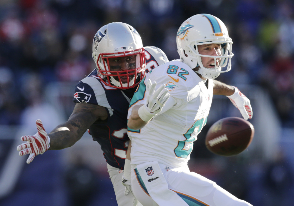 Miami Dolphins wide receiver Brian Hartline (82) can’t catch a pass in front of New England Patriots cornerback Brandon Browner, rear, in the first half last week in Foxborough, Mass. The Patriots won 41-13. New England plays the New York Jets on Sunday.