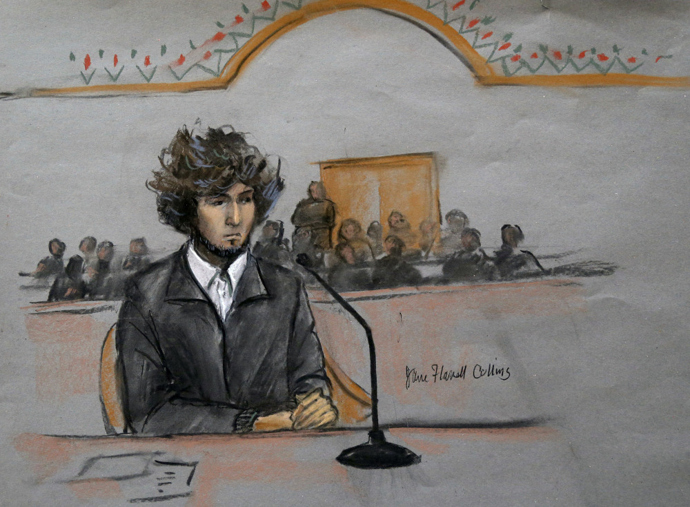 In this courtroom sketch, Boston Marathon bombing suspect Dzhokhar Tsarnaev is depicted sitting in federal court in Boston Thursday, Dec. 18, 2014, for a final hearing before his trial begins in January.