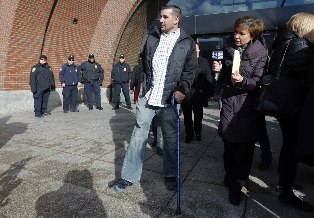 Boston Marathon bombing victim Marc Fucarile leaves federal court in Boston, Thursday, Dec. 18, 2014, after a hearing for bombing suspect Dzhokhar Tsarnaev, whose trial begins in January. Tsarnaev is charged with carrying out the April 2013 attack that killed three people and injured more than 260.