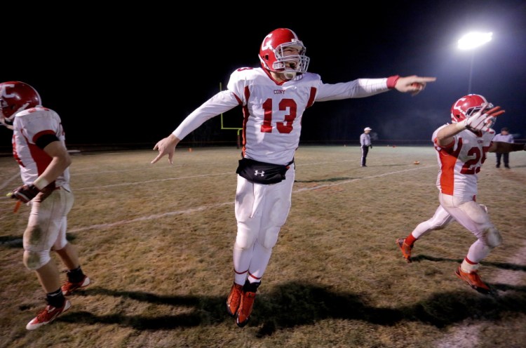 Cony quarterback Ben Lucas, center, leaps in celebration after the Rams defeated Brunswick to win the Pine Tree Conference title in November 2013. teammates during a 2013 game. Lucas announced he will start taking classes at Wagner College in Staten island, N.Y. this January with the hope of returning to the gridiron this spring.