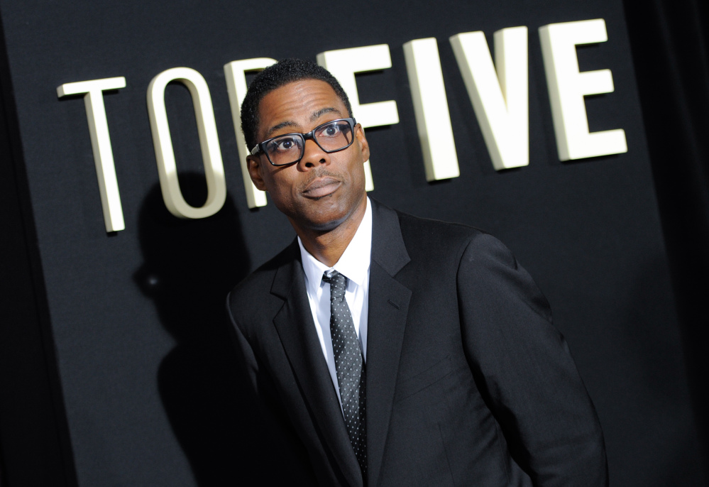In this Dec. 3, 2014 file photo, actor Chris Rock attends the premiere of “Top Five” at the Ziegfeld Theatre in New York.