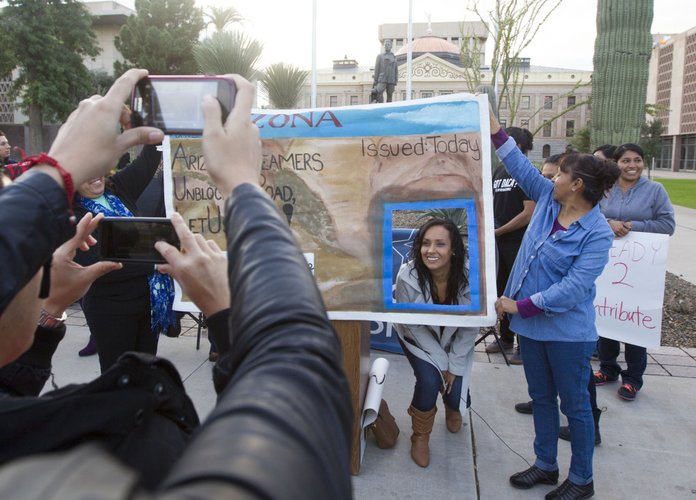 Erika Andiola gets her portrait taken at the Arizona State Capitol on Dec 17, 2014, in Phoenix, Ariz.