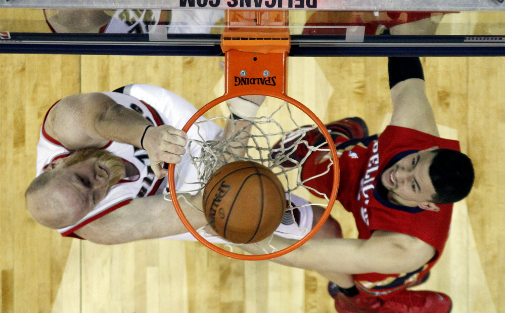 Portland Trail Blazers center Chris Kaman (35) dunks over New Orleans Pelicans guard Austin Rivers (25) during the second half last week in New Orleans. The Trail Blazers discovered a rattlesnake in its locker room recently while playing the San Antonio Spurs.
