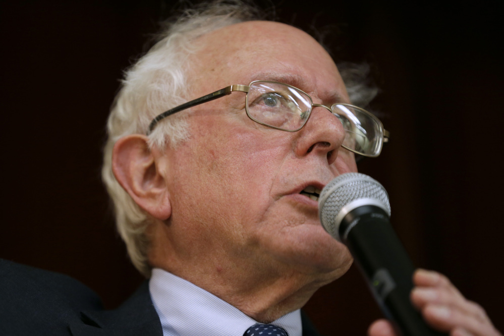 Sen. Bernie Sanders, I-Vt., speaks during a town hall meeting in Ames, Iowa on Dec. 16. Sanders says he’ll decide by March whether to launch a 2016 presidential campaign.
