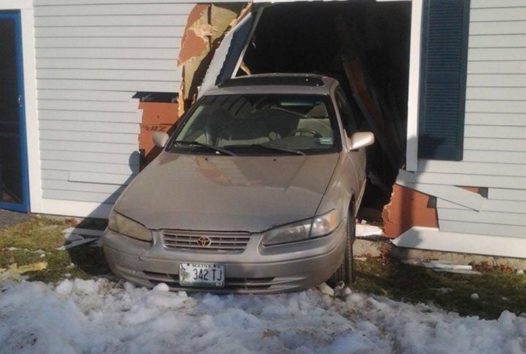 Police say a driver confused the gas and brake pedal, causing a car to crash into a house on Carver Street.
