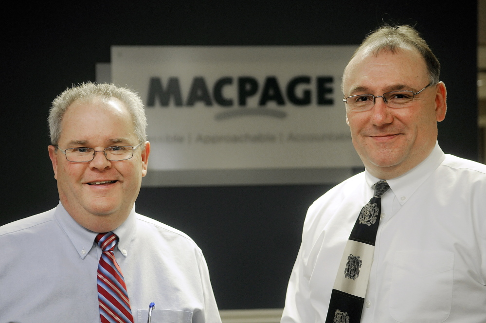 Macpage partners Scott Small, left, and Jeff Hubert at their Augusta office earlier this month. The firm is being recognized as Business of the Year by the Kennebec Valley Chamber of Commerce.
