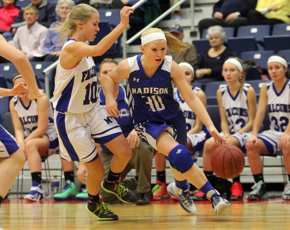 Madison Area Memorial High School’s Madeline Wood tries to dribble past Mountain Valley High School’s Emily Laubauskas during the first half of Saturday’s opening game at the annual Capital City Hoop Classic at the Augusta Civic Center. Madison lost the game 60-29.