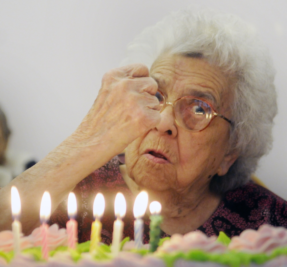 Though partially deaf, Gertrude Virgin encouraged everyone to quiet down Sunday before she blew out the candles of the cake for her 106th birthday in Gardiner. Friends and family celebrated the milestone with cake and cards.