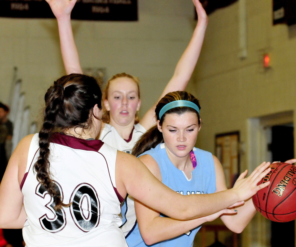 Maine Central Institute’s Katie Hughes, left, and Cassie Miller pressure an Oceanside player during game on Monday.