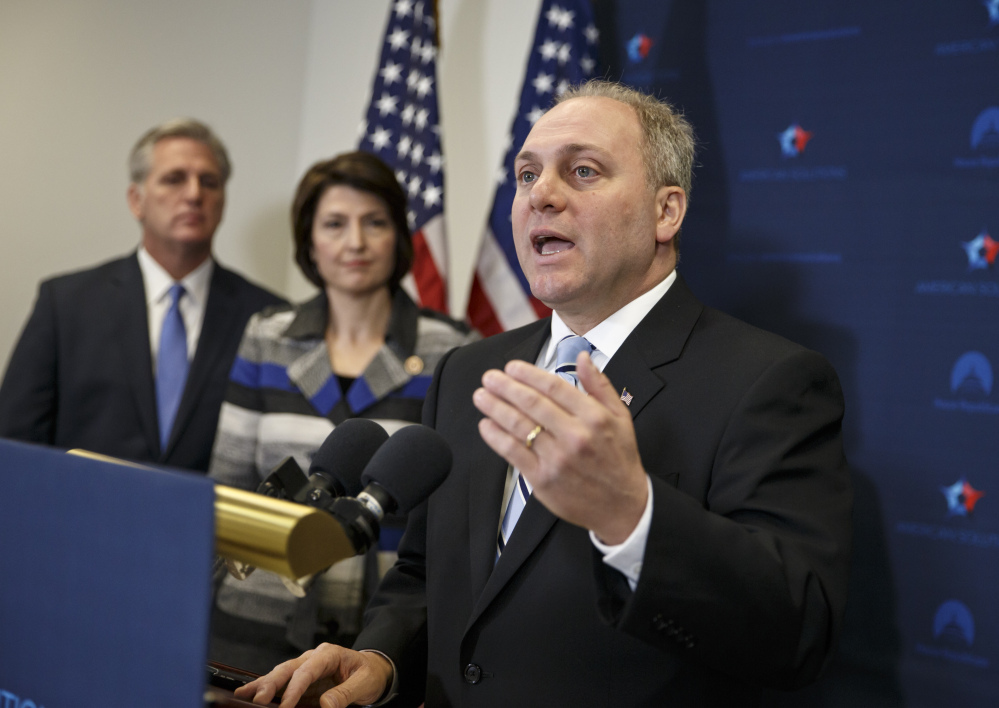 In this Nov. 18, 2014 file photo, House Majority Whip Steve Scalise of La., right, with House Majority Leader Kevin McCarthy of Calif., left, and Rep. Cathy McMorris Rodgers, R-Wash., speaks to reporters on Capitol Hill in Washington, following a House GOP caucus meeting.