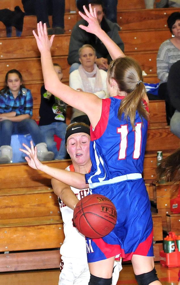 Messalonskee’s Taylor Easler (11) blocks Skowhegan’s Cailee Manzer during a game in Skowhegan on Tuesday.