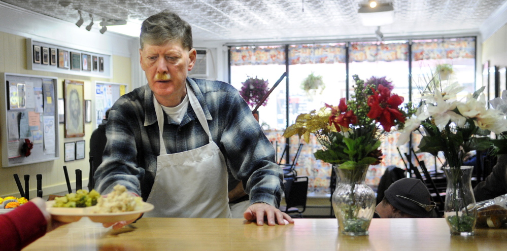 The Bread of Life soup kitchen in downtown Augusta served 2,000 more meals in 2014 than it did in 2013. In this file photo, Roy Rabe gets ready to serve a meal at the soup kitchen.