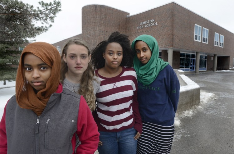 This 2014 file photo shows Senior Kalgaal Issa, junior Chandler Clothier, junior Iman Abdalla and senior Muna Mohamed, who were among the Lewiston High School students who were asked to take down a protest poster inside the school in December 2014. 