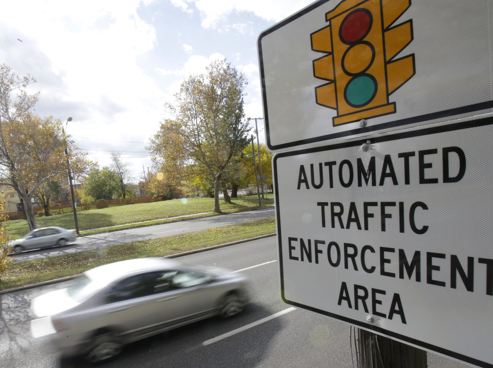 A sign warns of upcoming traffic cameras in Cleveland. A divided Ohio Supreme Court on Thursday again upheld use of traffic camera enforcement by the state’s municipalities.  The Associated Press