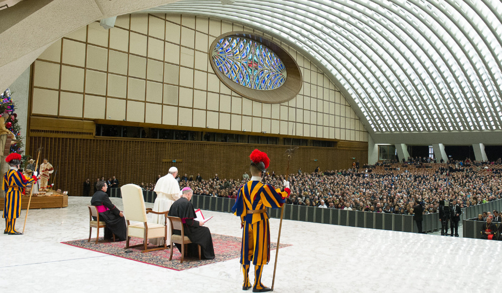 Pope Francis delivers his speech during an audience with the Holy See’s employees in the Paul VI hall at the Vatican on Monday. The Associated Press