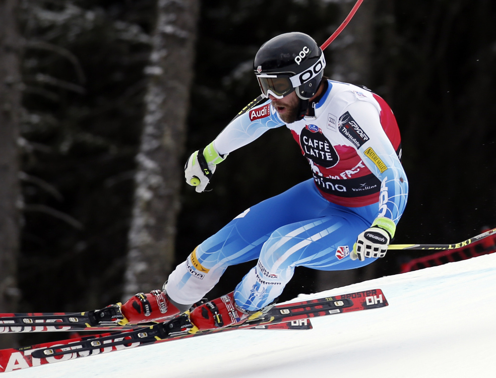 Travis Ganong speeds down the course on his way to win an Alpine men’s World Cup downhill, in Santa Caterina Valfurva, Italy, on Sunday. The Associated Press