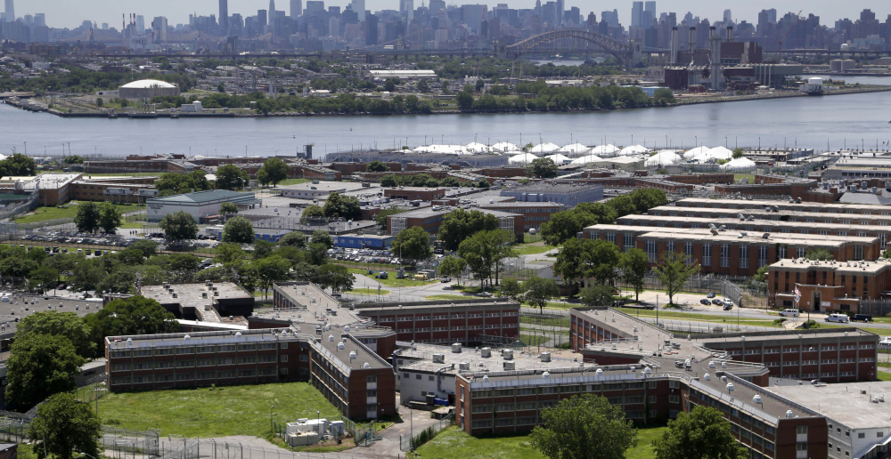 Mere miles from New York City’s skyscrapers, Rikers Island sits by itself on the East River, a 10-jail facility where an average of 11,000 inmates a night – men, women and youths – are detained on charges ranging from trespassing to murder. “It’s a world on its own there,” says a former inmate. The Associated Press