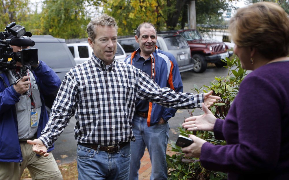 Sen. Rand Paul, R-Ky., seen greeting state Republican Chair Jennifer Horn in Concord, N.H., is showing an ability to appeal to minorities and young people. The Associated Press