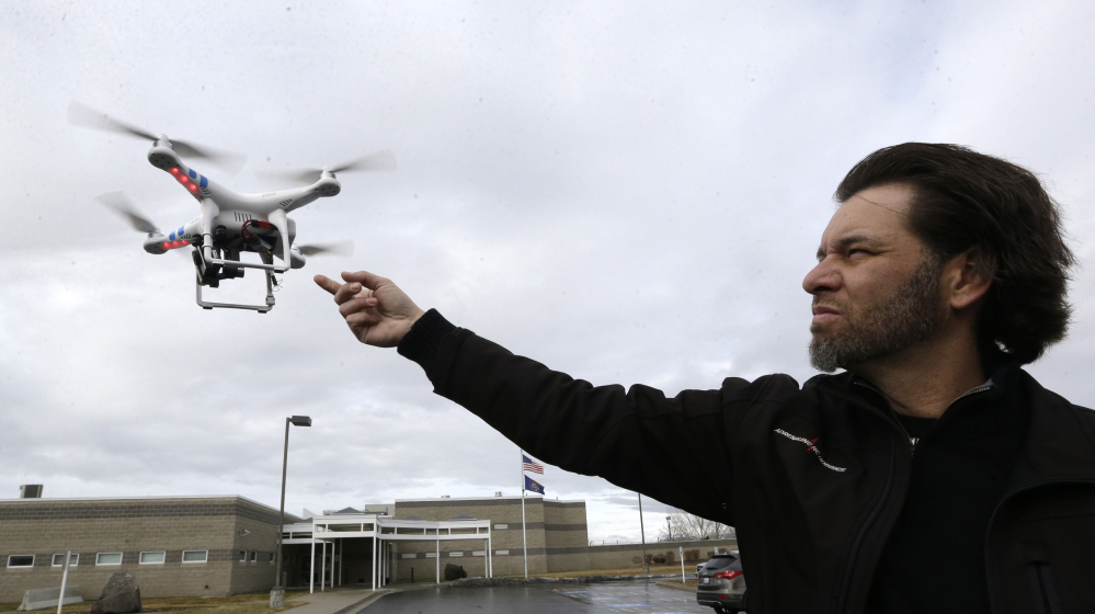 Jon McBride, who designs and builds drones with Digital Defense Surveillance, flies a training drone for members of the the Box Elder County Sheriff's Office search and rescue team, during a demonstration in February in Brigham City, Utah. 2014 File Photo/The Associated Press