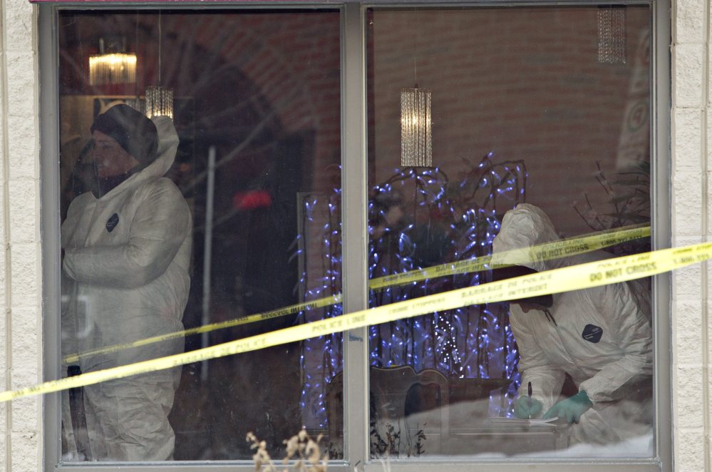 Police investigate a scene where a car rammed a truck and damaged a restaurant in Fort Saskatchewan, Alberta, on Tuesday. Edmonton City Police Chief Rod Knecht spoke Tuesday about multiple homicides that took place at different scenes overnight in Edmonton, Alberta. The Associated Press/The Canadian Press