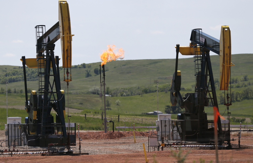 Methane flares off an oil well in North Dakota above. A methane “hot spot” in New Mexico is as large as the state of Delaware according to NASA. The gas will likely be a flashpoint as the government tries to regulate leaks in the new year. The Associated Press