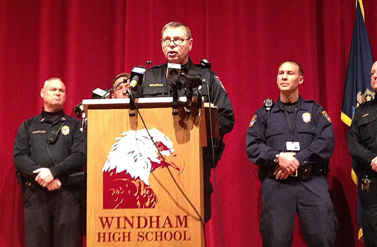 Windham police Lt. Jim Boudreau announces details of the case at a news conference at the high school Wednesday morning.. He said the suspect is charged with one count of felony terrorizing for each school that was shut down. Photo by Gillian Graham / Staff Writer