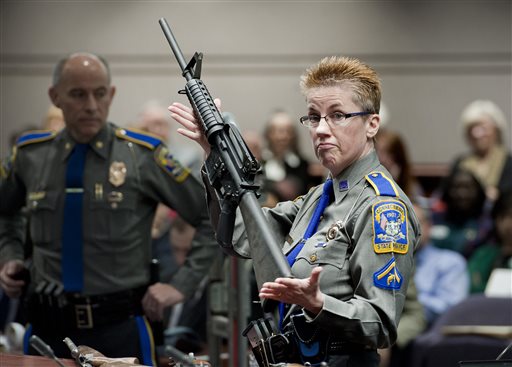 Firearms training unit Detective Barbara J. Mattson, of the Connecticut State Police holds a Bushmaster AR-15 in this  Jan. 28, 2013, photo. It is the same make and model of the gun used by Adam Lanza in the Sandy Hook School shooting. The Associated Press