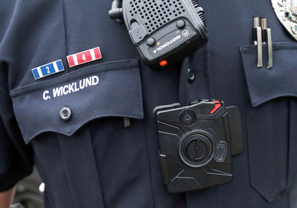 Sgt. Chris Wicklund of the Burnsville (Minnesota) Police Department wears a body camera beneath his microphone. The goal in Burnsville is to have all uniformed offices equipped with cameras by the end of the year. The Associated Press