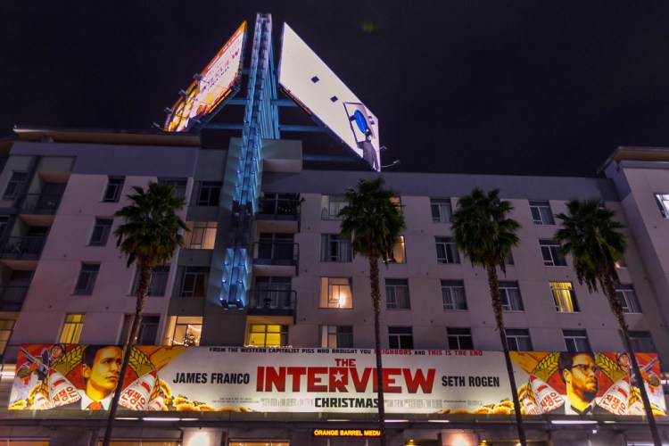 A banner advertising the film "The Interview" hangs at Arclight Cinemas in the Hollywood section of Los Angeles on Dec. 17, before Sony Pictures canceled the film's release. The Associated Press