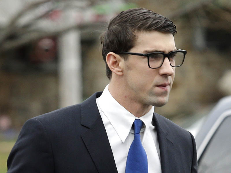 Olympic swimmer Michael Phelps walks into a courthouse for a trial on drunken driving and other charges, on Friday. The Associated Press