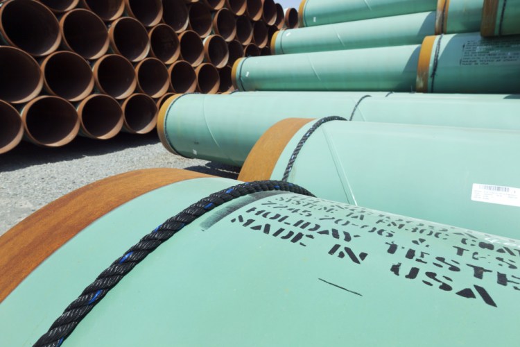 In this May 24, 2012, photo, about 500 miles worth of coated steel pipe manufactured by Welspun Pipes Inc. for the Keystone oil pipeline is stored in Little Rock, Ark. The Associated Press
