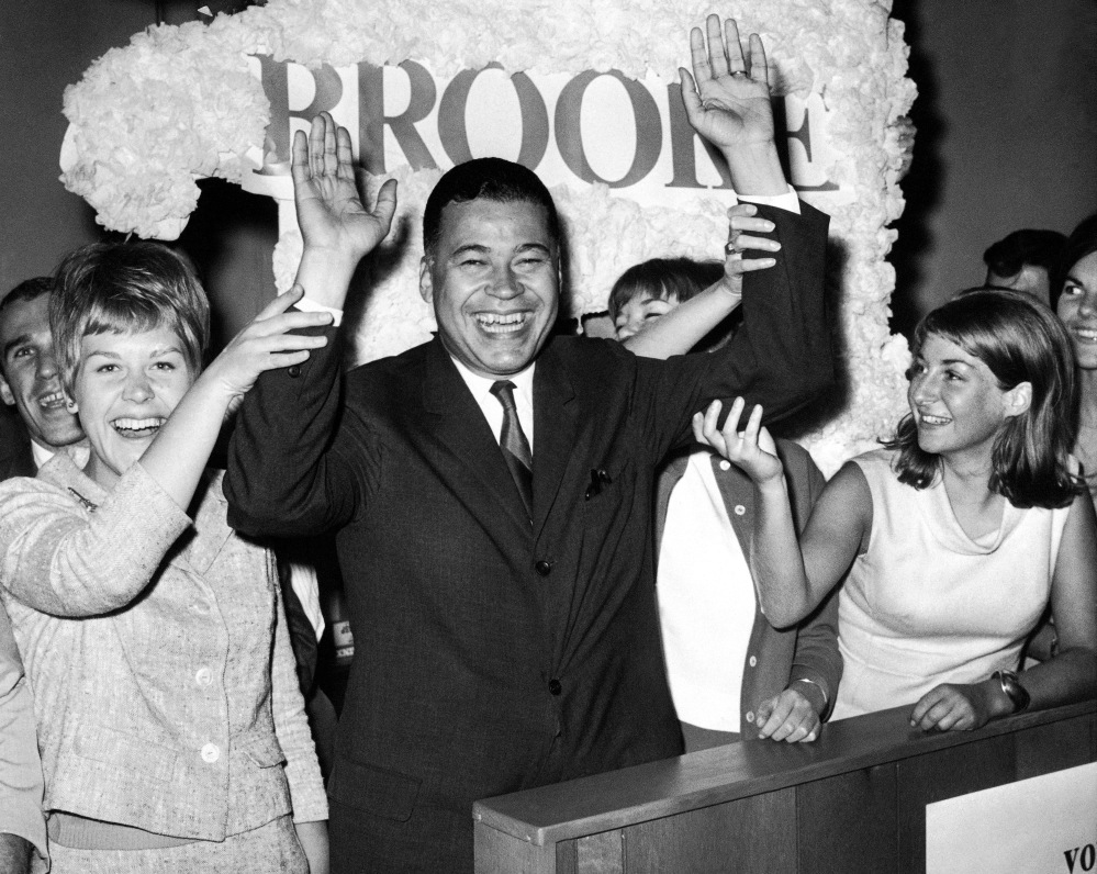 This Sept. 14, 1966, file photo shows Edward W. Brooke joining campaign workers in celebration, in Boston, after winning the Republican nomination for U.S. Senate.