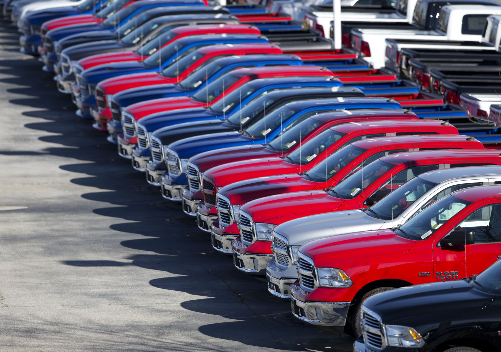 Dodge Ram pickup trucks are on display Monday at Landmark Dodge Chrysler Jeep in Morrow, Ga. Ram truck sales rose 24 percent in 2014.