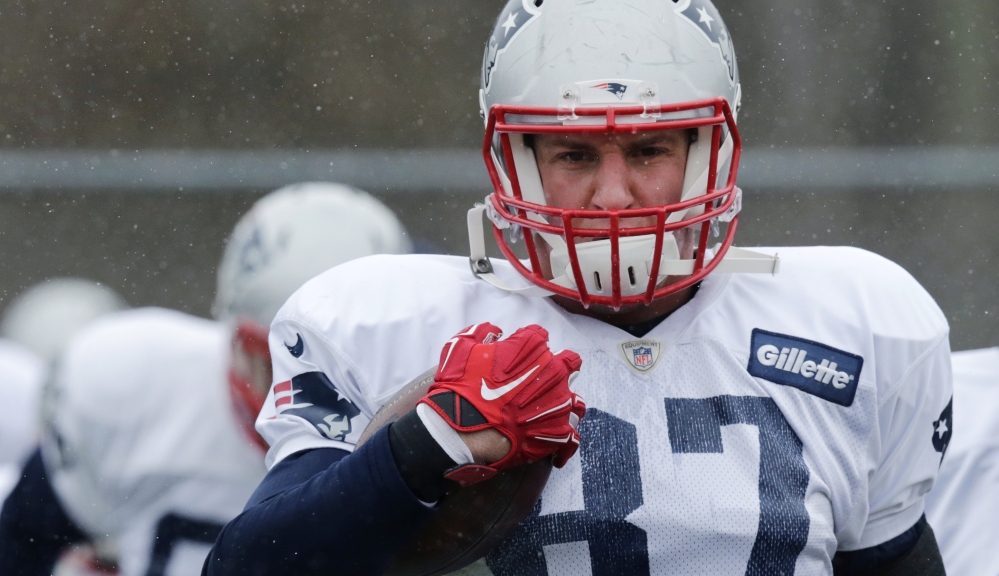 New England Patriots tight end Rob Gronkowski runs a drill during practice Tuesday in Foxborough, Mass. The Patriots face the Baltimore Ravens in a divisional playoff Saturday.