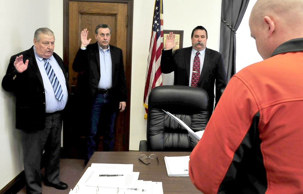 Somerset County Commissioners take the oath of office Wednesday. From left are Lloyd Trafton, Newell Graf Jr. and Dean Cray.