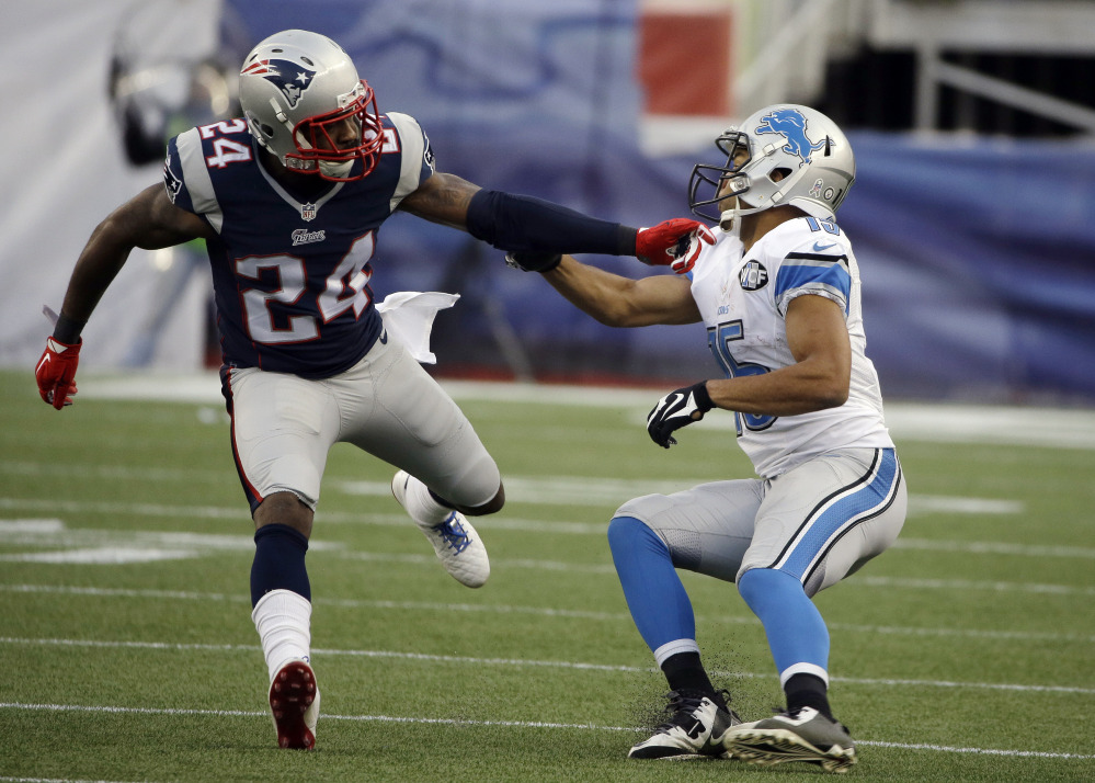 New England Patriots cornerback Darrelle Revis (24) defends against Detroit Lions wide receiver Golden Tate, right, in the second half of a game in Foxborough, Mass. Revis’ skills will be on display Saturday, when the Patriots host the Baltimore Ravens in a divisional playoff game.