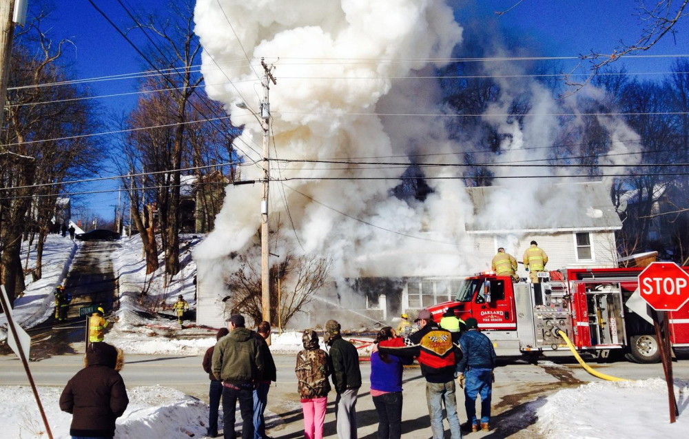 Firefighters respond to a home fire on Water Street on Thursday morning,