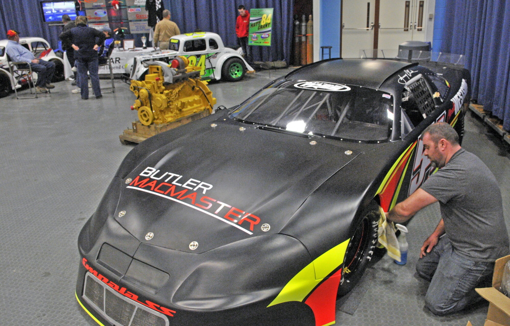 Johnny Clark polishes one of his race cars just before the start of the 27th annual Northeast Motorsports Expo and Trade Show on Friday at the Augusta Civic Center.