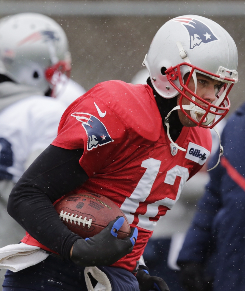 New England Patriots quarterback Tom Brady runs a drill during a recent practice in Foxborough, Mass. The Patriots face the Baltimore Ravens in a divisional playoff on Saturday.
