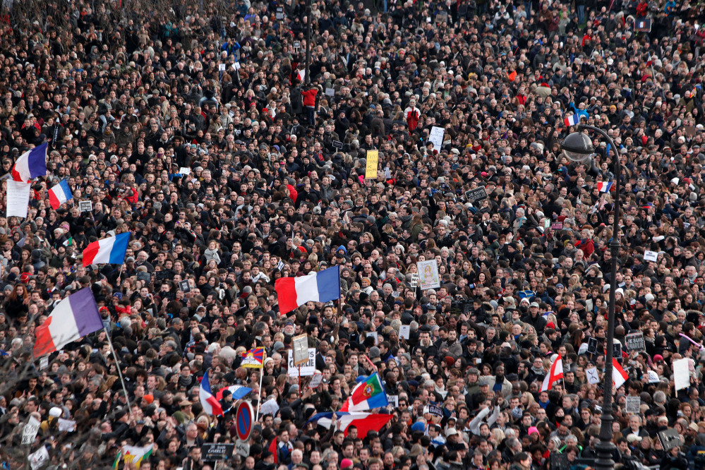 Thousands of people gather at Place de la Nation during a rally in Paris, Sunday, Jan. 11, 2015. Hundreds of thousands gathered Sunday throughout Paris and cities around the world, to show unity and defiance in the face of terrorism that killed 17 people in France’s bleakest moment in half a century. (AP Photo/Thibault Camus)