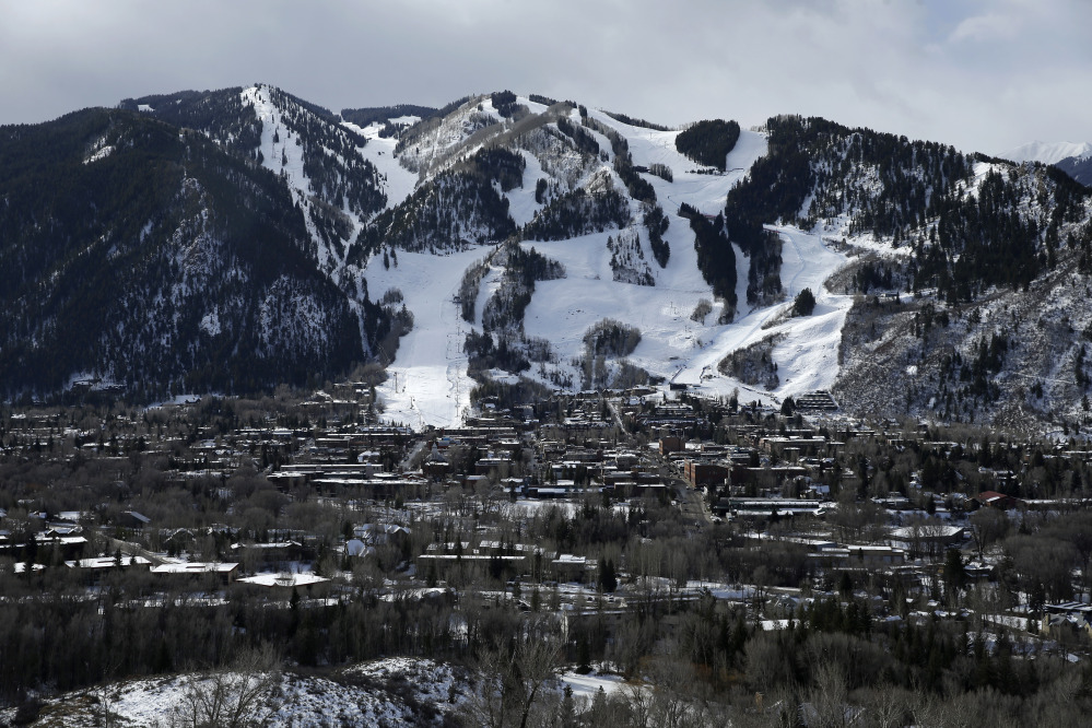 This Dec. 1, 2014 photo shows the Aspen Mountain ski area by Aspen, Colo. Resort towns like Aspen dramatically demonstrate an unnerving trend: Across the country, the rich are getting richer while the rest of the country is essentially treading water.