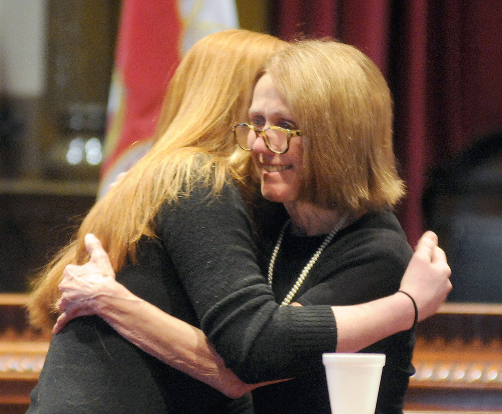 Superior Court Justice Nancy Mills, right, hugs Jennifer Higgins Monday during graduation ceremonies for the Co-Occuring and Veterans courts in Augusta. Higgins was one of 14 people who completed the intensive program administered at Kennebec County Superior Court by Mills.