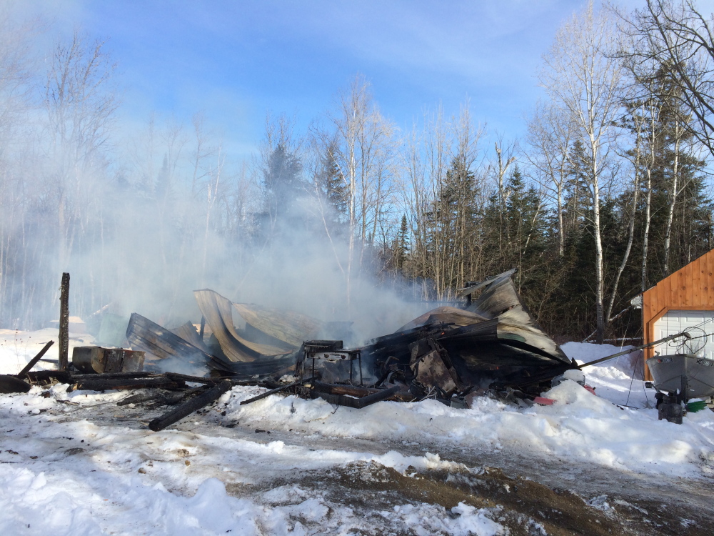 A cabin home at 205 Rowe Plantation Rd. in Pleasant Ridge Plantation was destroyed in an early morning fire Wednesday.  The 73-year-old resident was alerted to the fire by his dog. Staff photo by Rachel Ohm