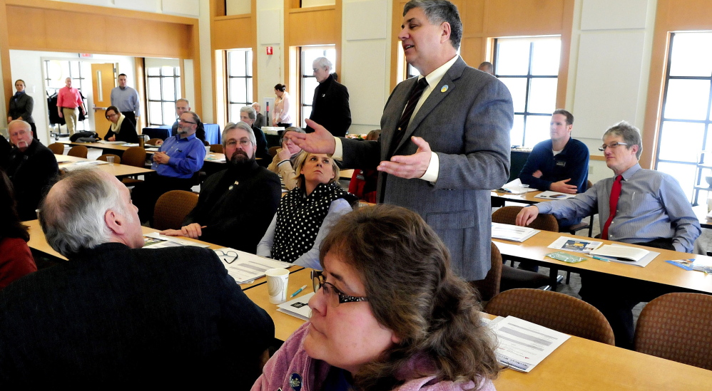 Rep. Scott Cyrway, R-Benton, asks questions of medical and insurance officials during a health care workshop for state legislators at the Franklin Memorial Hospital in Farmington on Thursday. At right is Rep. Andy Buckland, R-Farmington.
